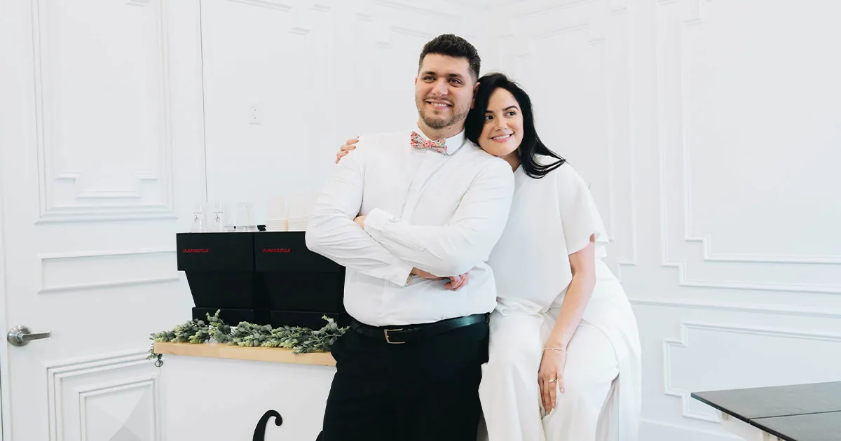 Brightside Coffee Bar team beside a styled white coffee cart in Houston