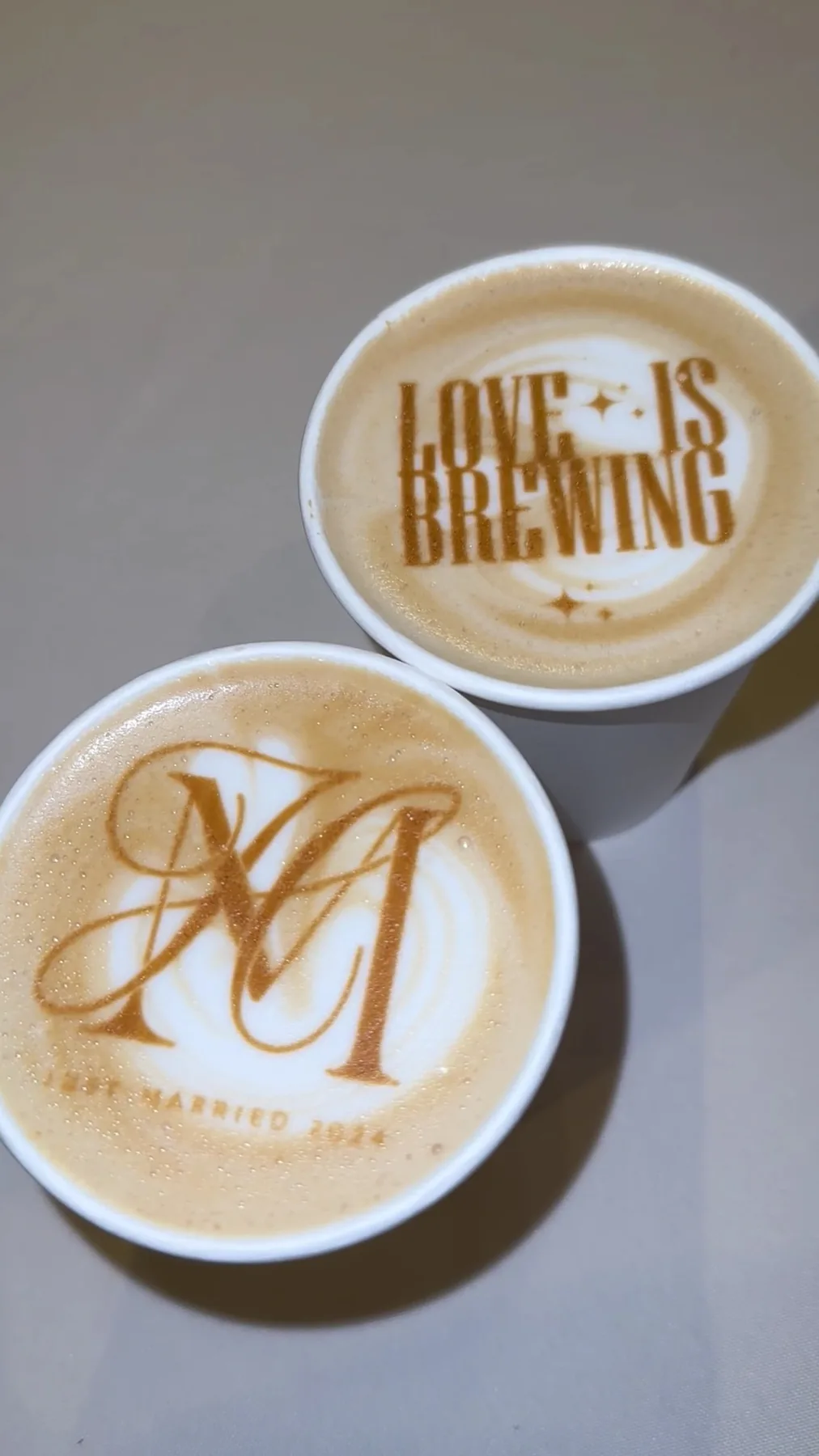 Custom monogram and Love Is Brewing latte art printed on lattes at a Houston wedding