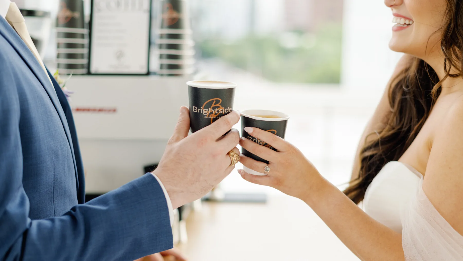 Wedding guests toasting with branded Brightside coffee cups in Houston
